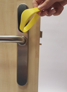 Door being opened with an access control band